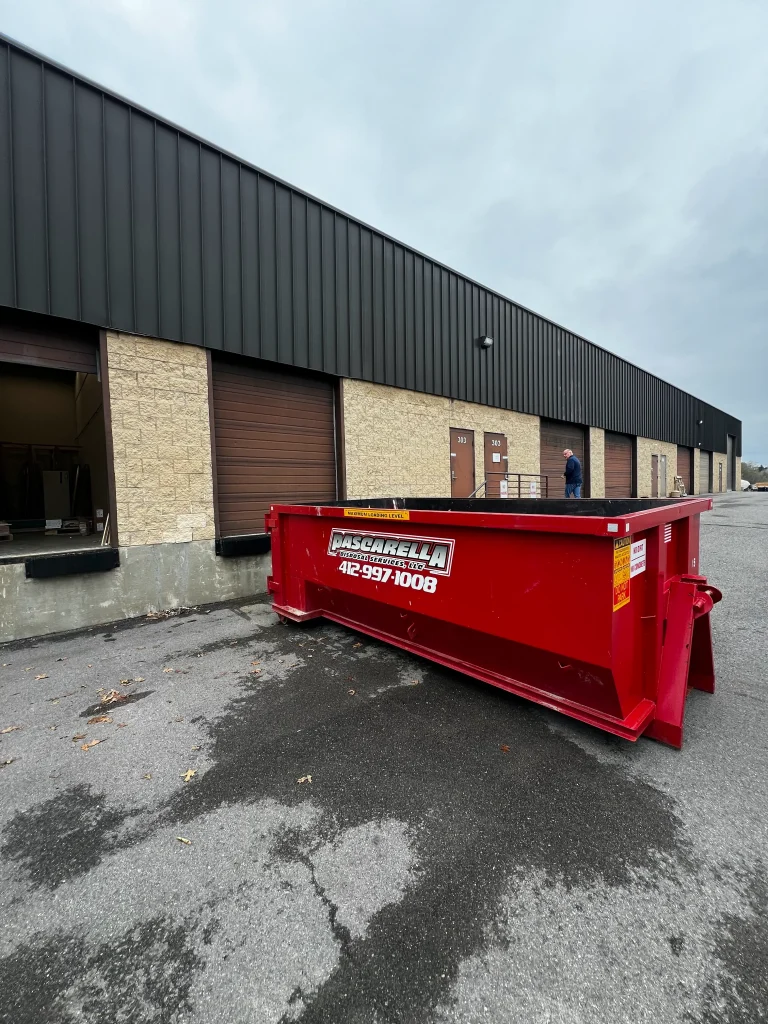 Pascarella roll-off dumpster outside a Pittsburgh industrial unit