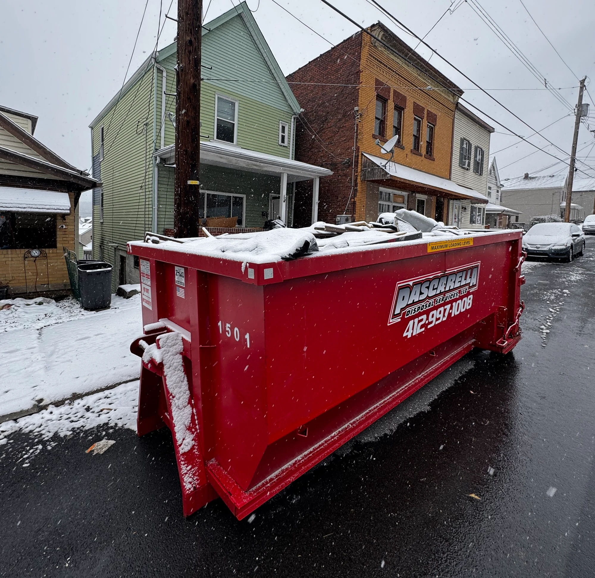 Pascarella 20-yard dumpster on a snowy Pittsburgh street